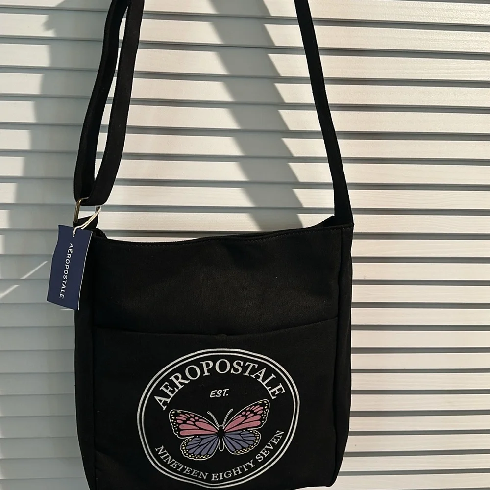 NWT Aeropostale 1987 Black Canvas Crossbody bag with adjustable Strap.
